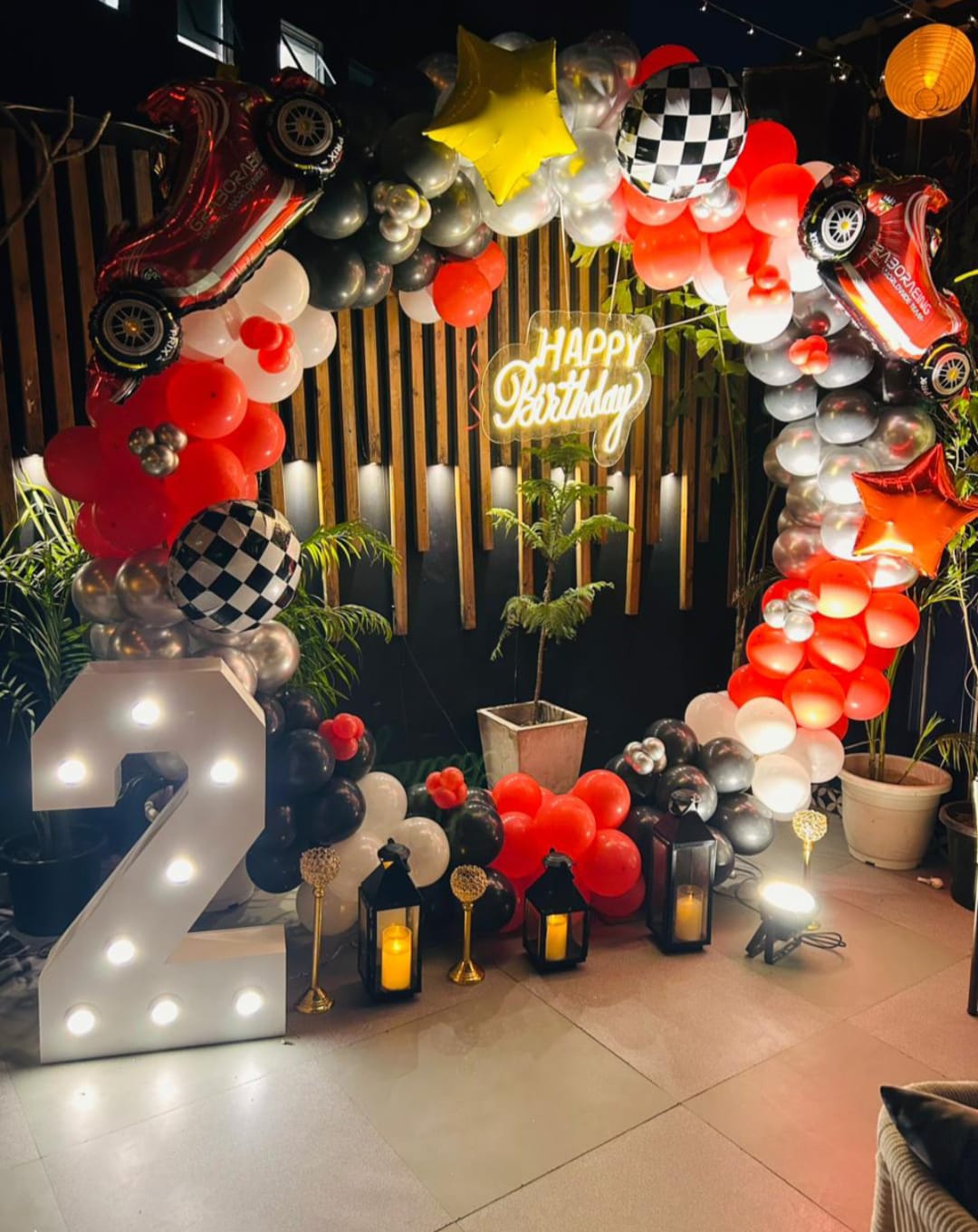 Circular balloon ring frame setup red, black, white, and silver theme